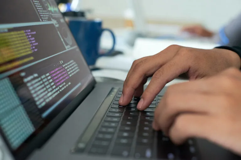 Developer coding a modern business website